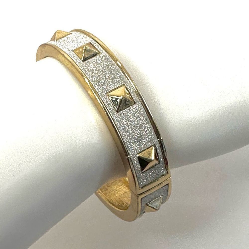 Silver and gold tone spiked bangle bracelet